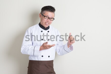 Mature Asian chef thumbs up Stock photo © szefei