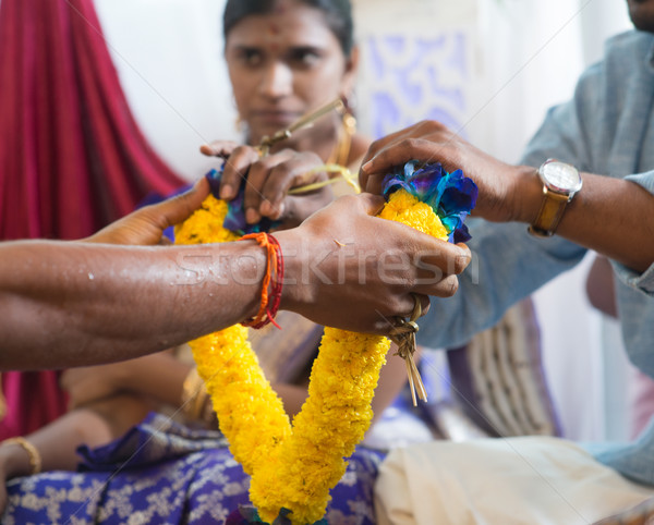 Indian people received flower garland from priest. Stock photo © szefei