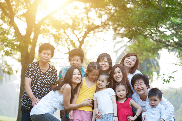 Large group of Asian multi generations family outdoors fun Stock photo © szefei