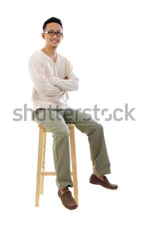 Full body Asian man sitting on a chair Stock photo © szefei