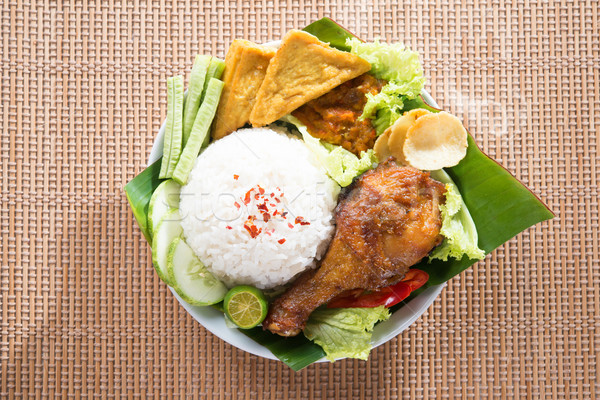 Tasty Asian food nasi ayam penyet Stock photo © szefei