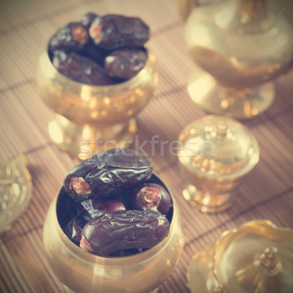 Dried date palm fruits, kurma Stock photo © szefei