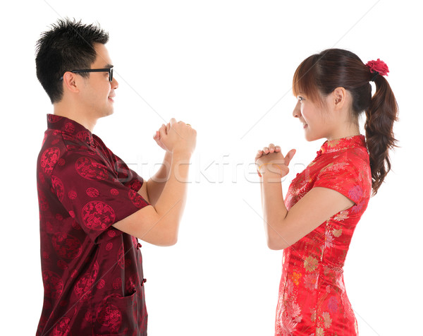 Chinese cheongsam people respecting to each other Stock photo © szefei