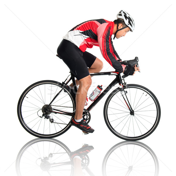 Asian male cyclist Stock photo © szefei