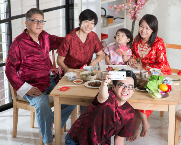 Asiatic chinez familie anul nou chinezesc reuniune cină Imagine de stoc © szefei