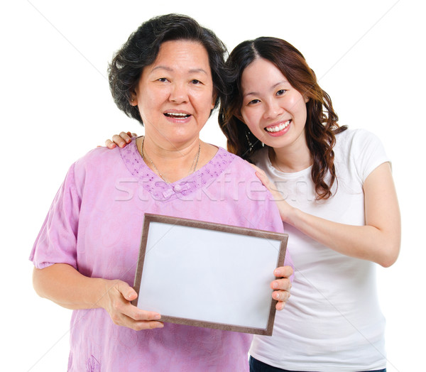 Asian family holding a blank board Stock photo © szefei