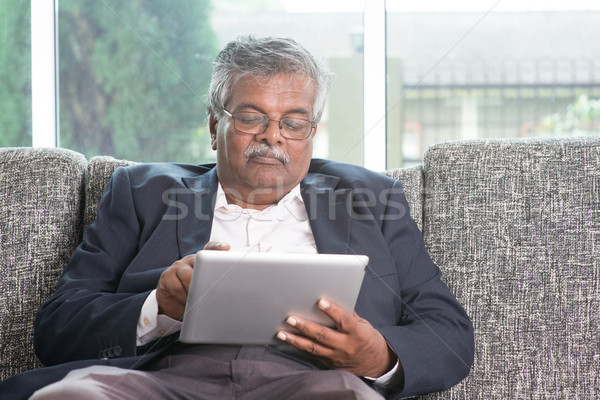 Old people using modern technology Stock photo © szefei