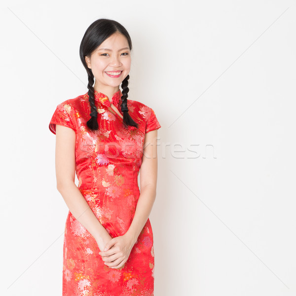 Oriental girl in red qipao Stock photo © szefei