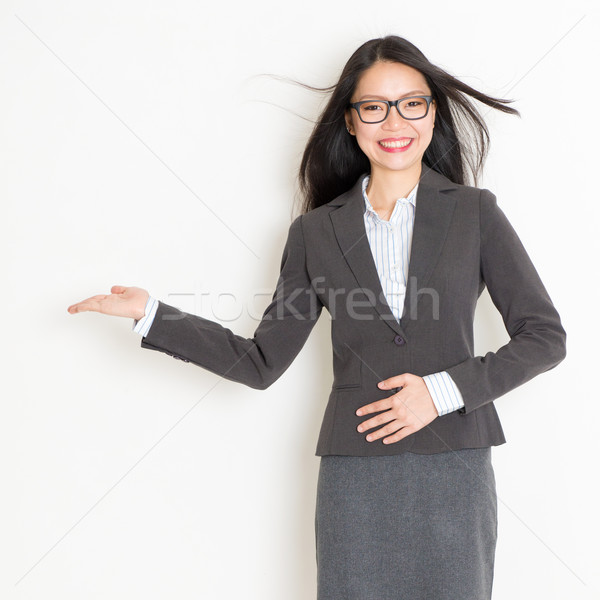 Businesswoman hand showing something Stock photo © szefei