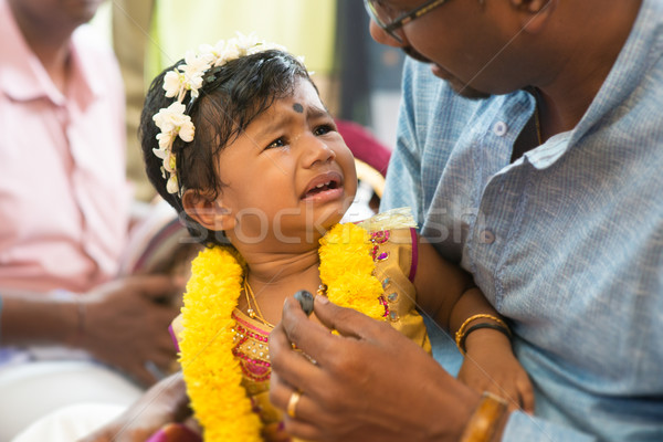 Traditional Indian Hindus ear piercing ceremony.  Stock photo © szefei