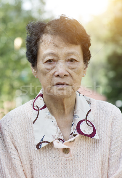 Sad Asian elderly woman  Stock photo © szefei