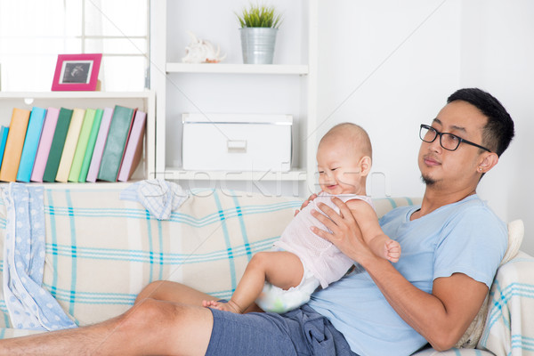 Exhausted father taking care baby alone  Stock photo © szefei