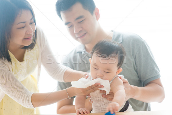 Baby blowing nose Stock photo © szefei