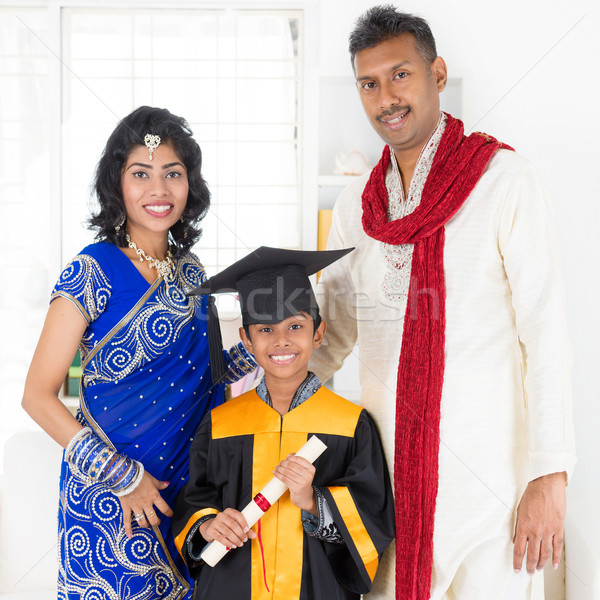 Parents and child on kinder graduate day Stock photo © szefei