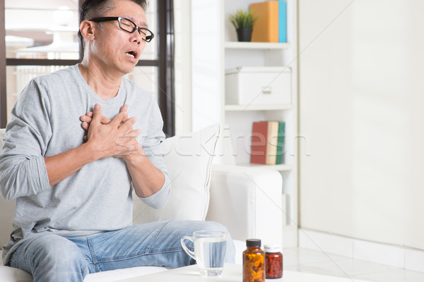 érett ázsiai férfi szívroham 50-es évek szívfájdalom Stock fotó © szefei