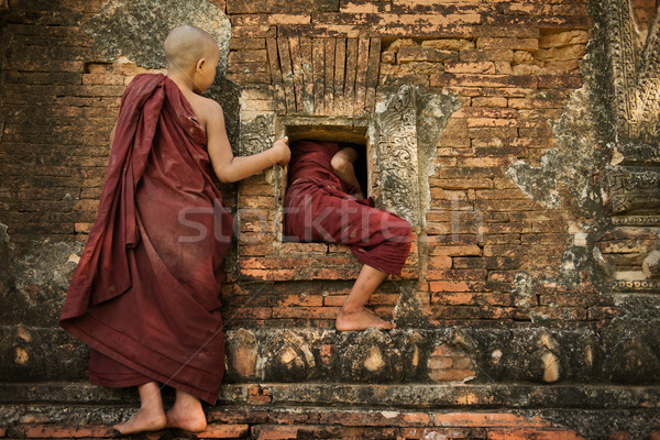 Playful young novice monks Stock photo © szefei
