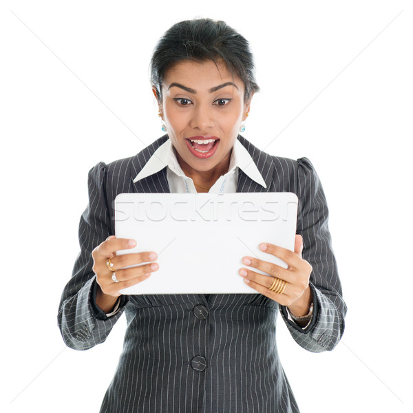 Black business woman using tablet pc  Stock photo © szefei