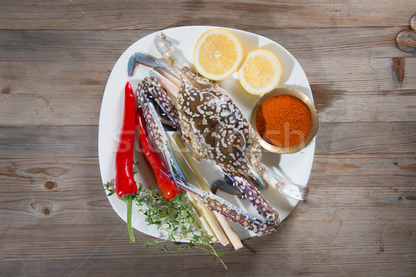 Raw blue crab and ingredients on plate Stock photo © szefei