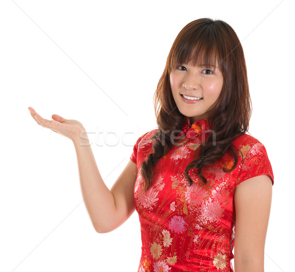 Chinese cheongsam girl showing blank space Stock photo © szefei