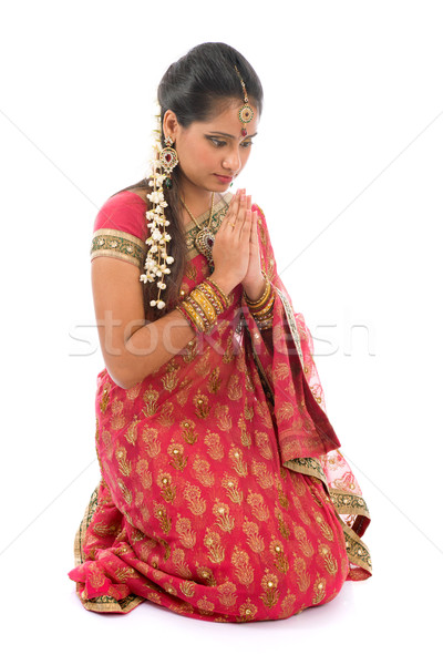 Indian girl in a praying position Stock photo © szefei