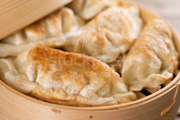 Chinese food pan fried dumplings Stock photo © szefei