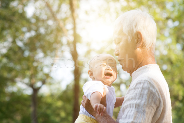 Grandfather and crying grandson. Stock photo © szefei