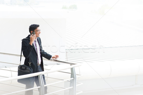 Candid Indian businessman talking on phone Stock photo © szefei