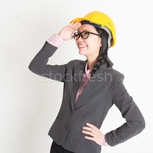 Female engineer looking away Stock photo © szefei