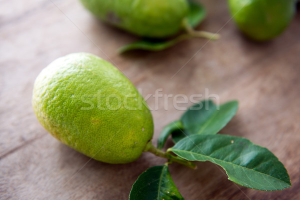 organic green lemons with leaves Stock photo © szefei