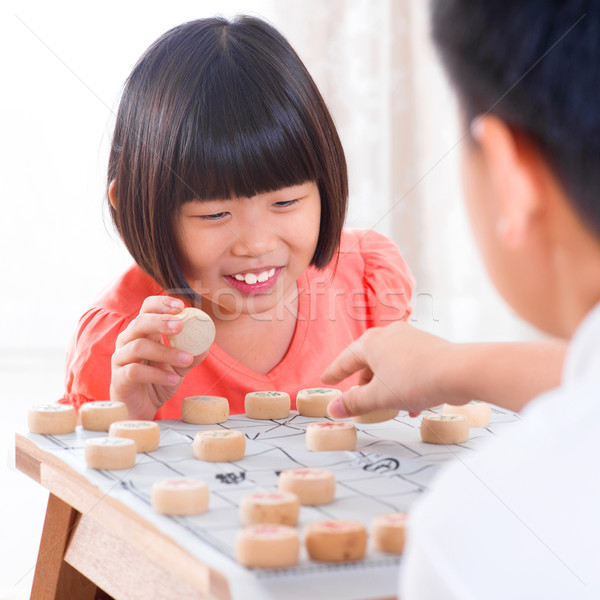 Asian playing Chinese chess Stock photo © szefei