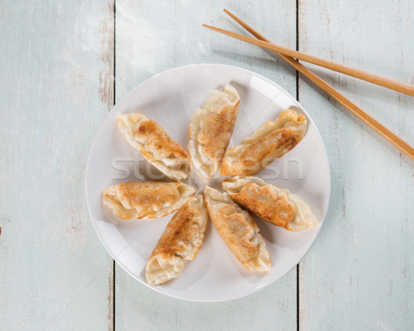 Top view Asian cuisine pan fried dumplings Stock photo © szefei