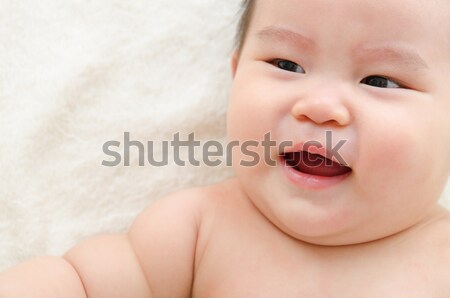 Upset Asian baby boy crying on bed Stock photo © szefei