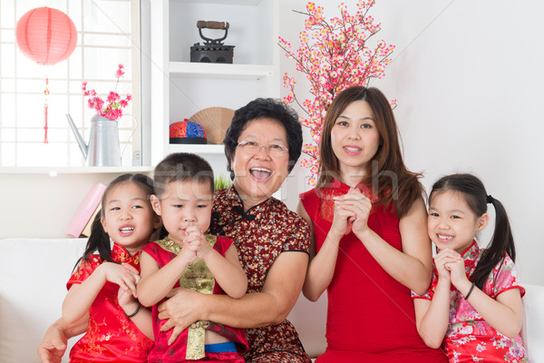  Happy Asian family reunion at home. Stock photo © szefei