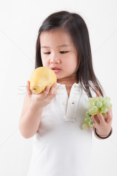 Eating fruits Stock photo © szefei