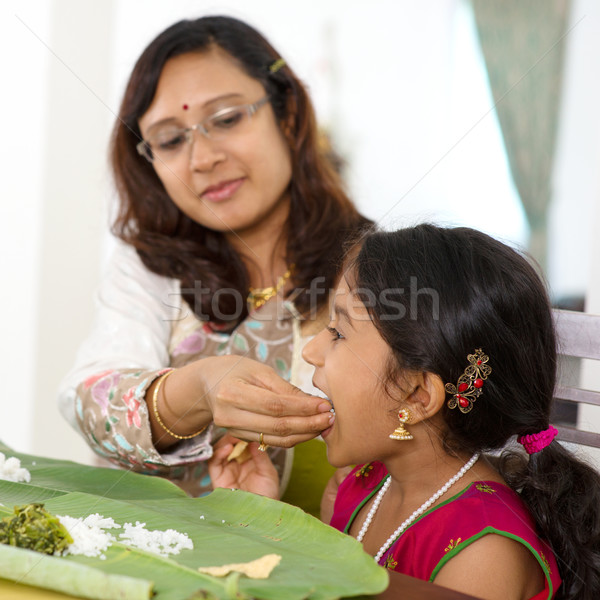 Stock photo: Mother feeding child