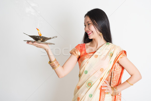 Girl with Indian sari dress holding oil lamp Stock photo © szefei