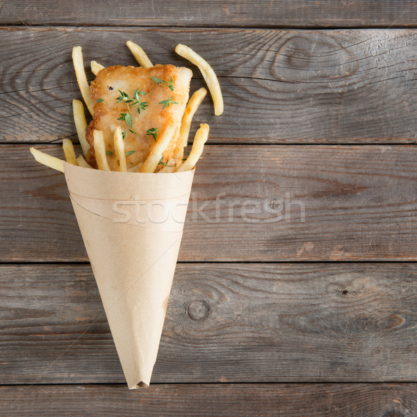 Top view fish and chips in paper cone Stock photo © szefei