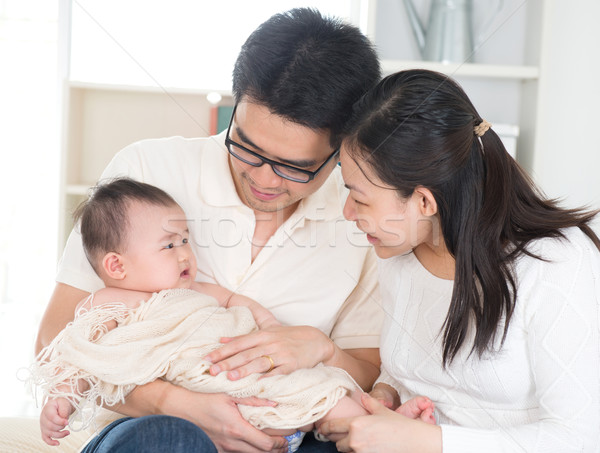 Parents pampering baby Stock photo © szefei