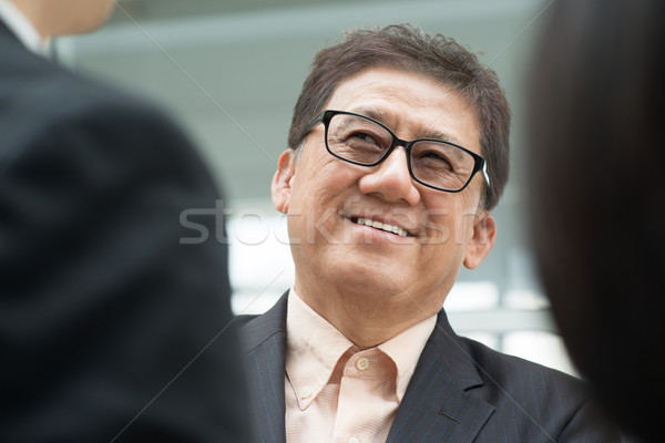 Senior businessman Stock photo © szefei