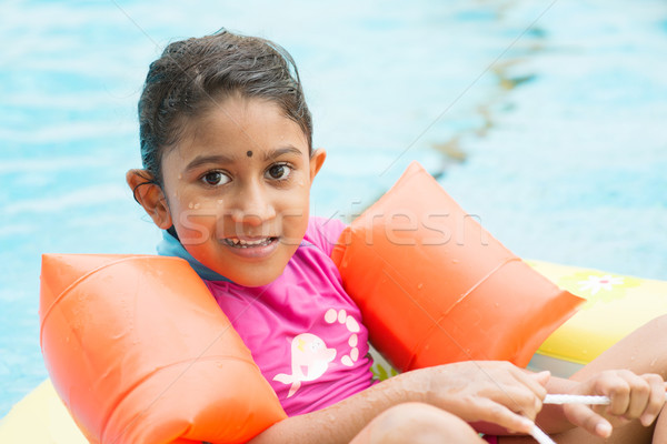 Indian girl swimming Stock photo © szefei