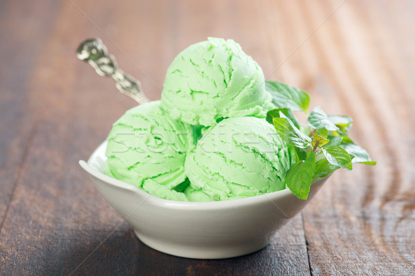 Pistachio ice cream in bowl Stock photo © szefei