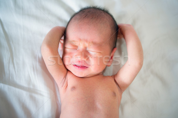New born baby crying Stock photo © szefei