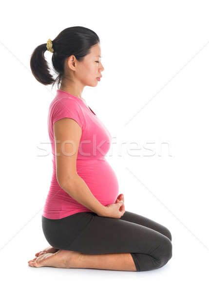 Stock photo: Pregnant woman meditation