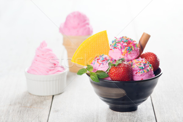 Pink ice cream with strawberry fruits Stock photo © szefei