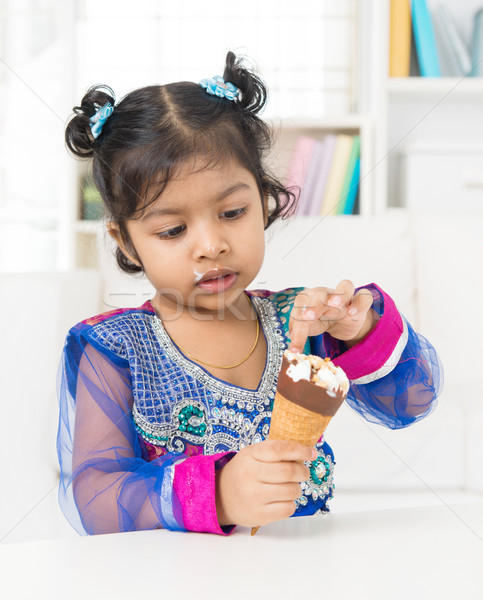 Little girl eating ice cream.  Stock photo © szefei