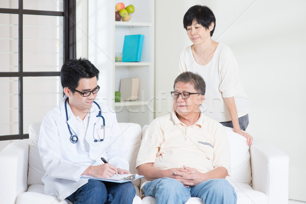 Doctor with old patient Stock photo © szefei