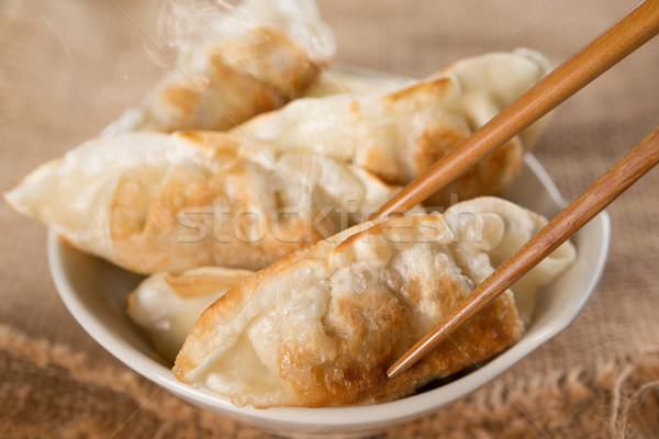 Famous Asian meal pan fried dumplings Stock photo © szefei