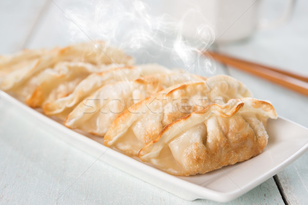Asian dish pan fried dumplings Stock photo © szefei