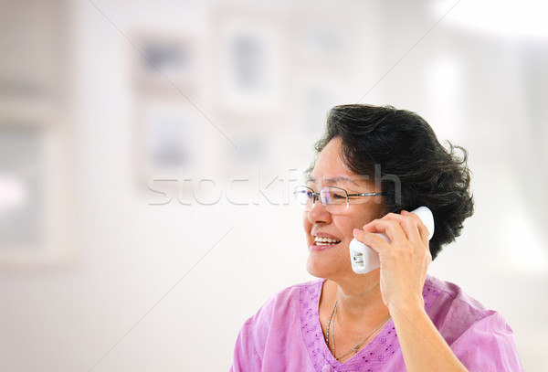 Happy phone calling Stock photo © szefei