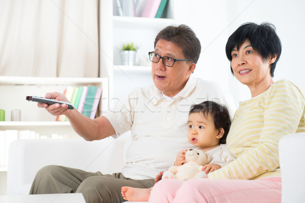 Asian family watching tv Stock photo © szefei